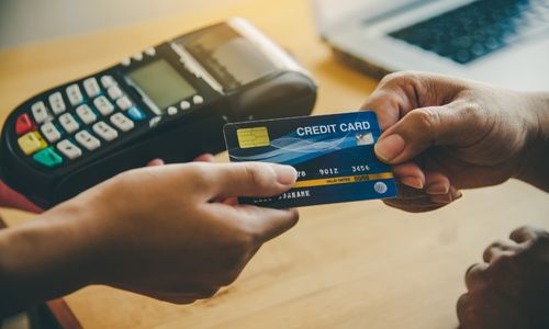 Customer passing credit card to merchant